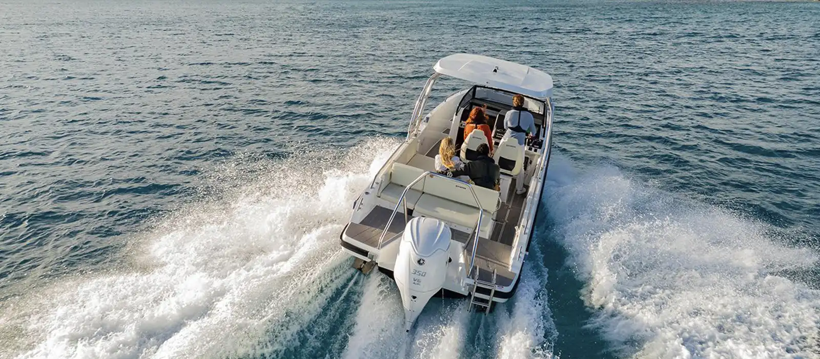 Boat in the water with Outboard.